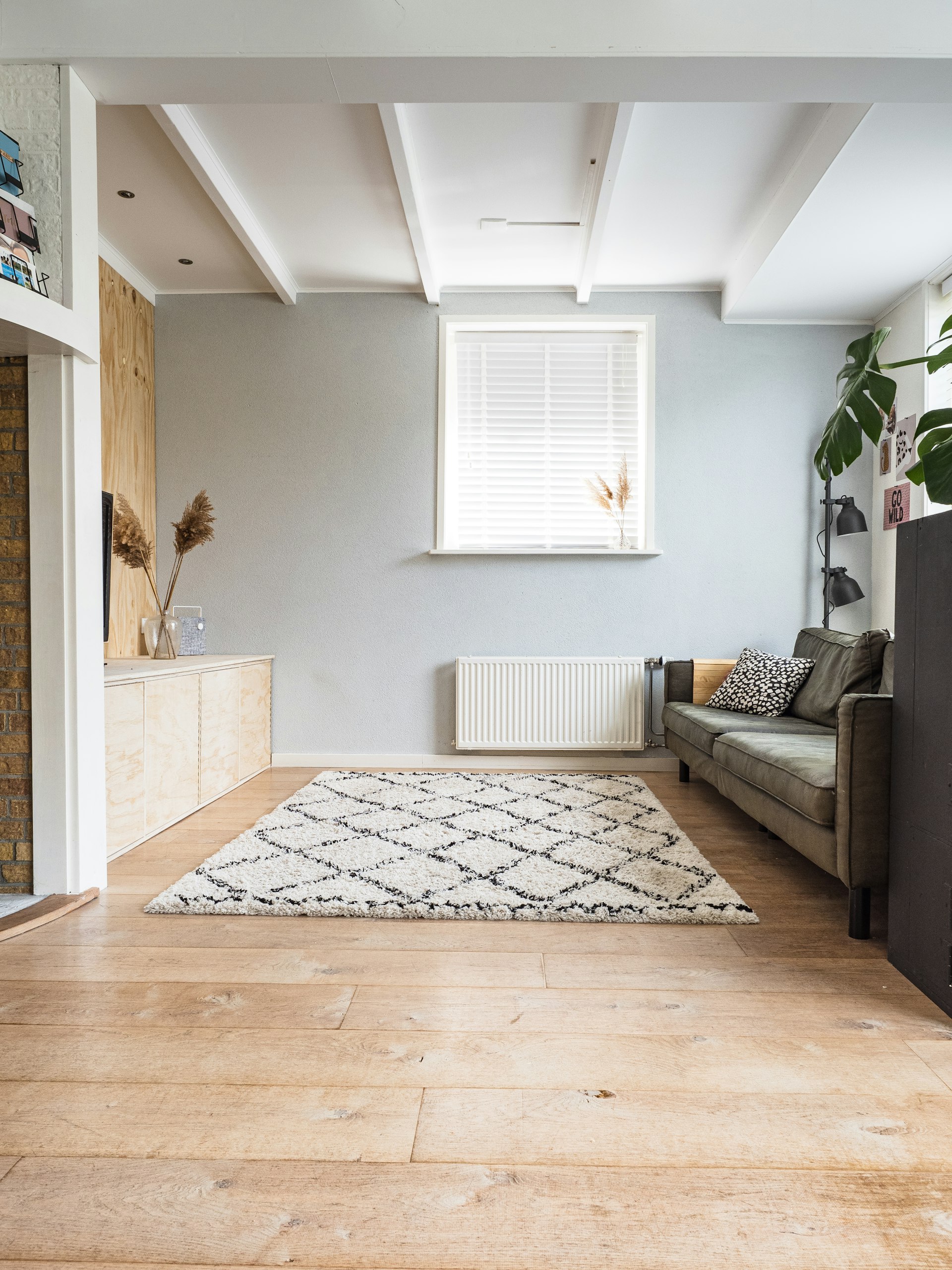 Warm oak floor in a sunlit room after a fresh sand and refinish.